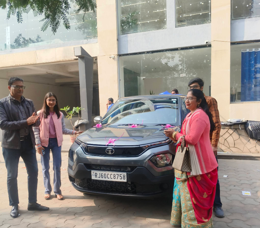 Family taking delivery of new Tata